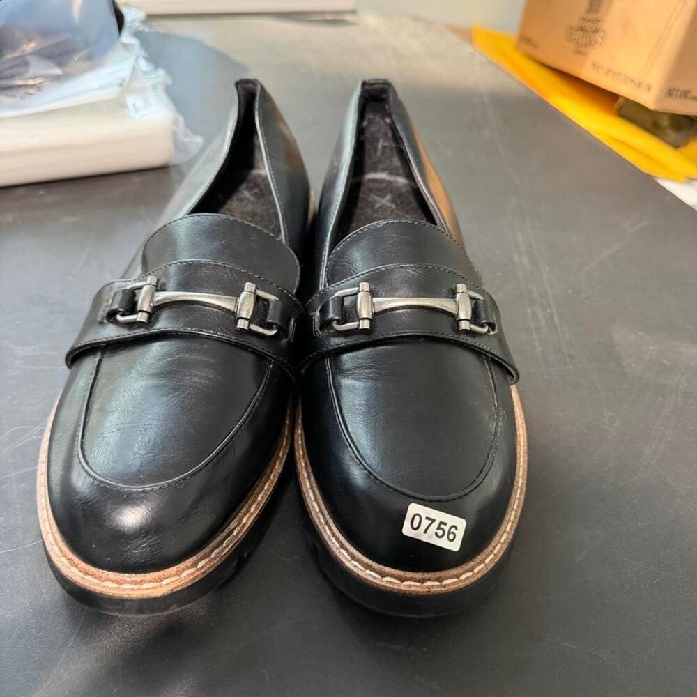 Black leather loafers with silver